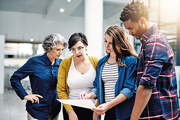 Image showing Document, diversity and designer team planning or brainstorming strategy in collaboration together at a startup. Company, growth and business analyst meeting of group of employees working in teamwork