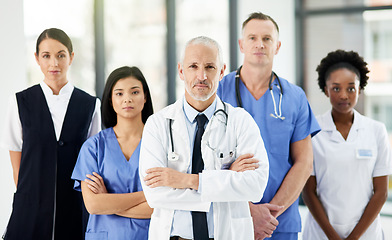 Image showing Healthcare, teamwork and portrait of doctors with nurses in hospital with arms crossed for leadership or support. Health, people and proud medical team with diversity in collaboration or solidarity