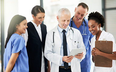 Image showing Digital tablet, team and group of healthcare workers in discussion on xrays in medicare clinic. Collaboration, diversity and professional medical employees analyzing a diagnosis on mobile in hospital