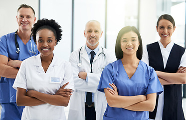 Image showing Confidence, crossed arms and portrait of team of doctors standing in the hallway with collaboration. Happy, diversity and group of healthcare workers in the corridor of a medical clinic or hospital.