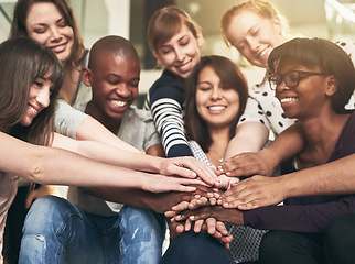 Image showing Goal, motivation and friends with their hands in a huddle together for education, support or success. Teamwork, smile and trust with a happy group of students bonding at college or university