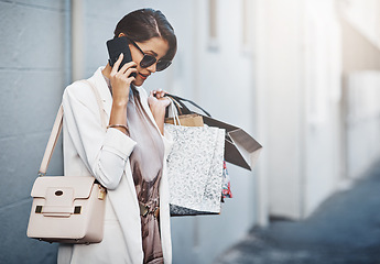 Image showing Phone call, shopping bag and woman in city for communication, discount or promotion of fashion. News, gift offer and customer or person with clothes sale, wealth and ecommerce or product review chat