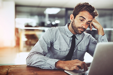 Image showing Business man, laptop and bored in office with thinking, glitch or tired with stress, anxiety and problem. Businessman, computer and exhausted at desk with fatigue, burnout and 404 error on internet