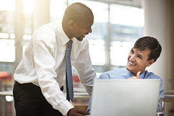 Image showing Manager, help and employee with a laptop, planning or brainstorming with collaboration, teamwork or startup success at a workplace. Male consultants, staff or coworkers with technology or partnership