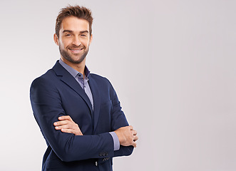 Image showing Portrait of confident business man, arms crossed in a suit with smile isolated on studio background. Professional mindset, career success and mockup space with corporate male employee and pride