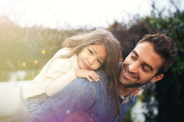 Image showing Happy, piggyback and playful with father and daughter in nature for bonding, family and affectionate. Smile, relax and happiness with man carrying young child in park for support, weekend and care