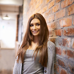 Image showing University, education and portrait of happy woman at college ready to study, class and learning. Scholarship, knowledge and face of female student leaning on wall at school, academy and campus