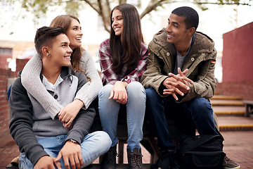 Image showing University, education and friends on campus in conversation, talking and chatting outdoors. Diversity, community and happy men and women students smile for learning at school, academy and college