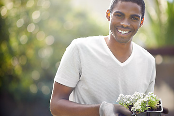 Image showing Black man, sustainability and flower growth in nature for space, environment development and smile. Plant, growing and sustainable eco friendly of a person with mockup, community for climate change