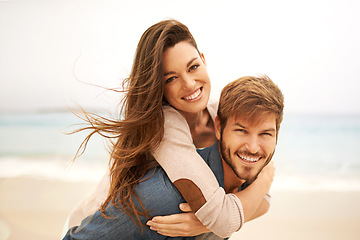 Image showing Portrait, piggyback and happy couple hug at beach for travel, romance and freedom together. Face, smile and loving woman playing with man on trip, vacation or holiday, bond or having fun in Mexico