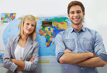 Image showing Travel agency portrait, arms crossed and happy business people, International agent or partner smile with world map. Confidence, collaboration or planning team working on holiday destination location