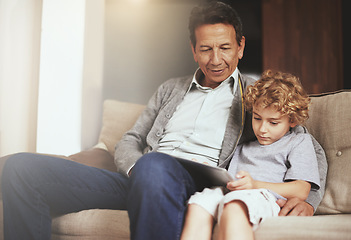 Image showing Tablet, child or grandfather streaming movie or film on online subscription in retirement at home to relax. Bond, grandparent or kid loves watching fun videos with a senior or mature old man on sofa