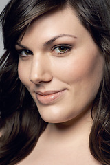 Image showing Woman closeup, natural beauty and portrait with skincare and dermatology. Cosmetics, happy face and young female person from Italy in studio with smile from skin treatment with makeup and wellness