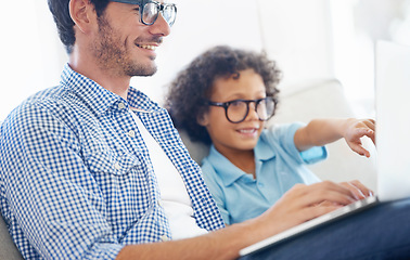 Image showing Remote work, laptop and happy family father with child, kid or people point at online website, ebook or social media. Freelance writer, home and man enjoy bonding time together with biracial boy