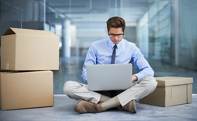 Image showing Moving box, office laptop and man typing business report, statistics analysis or search online, internet or website info. Relocation, cardboard boxes and male businessman, employee or person working