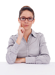 Image showing Serious, portrait and business woman in studio with attitude, assertive and focus on white background. Face, empowered and female person posing with confidence, proud and professional while isolated