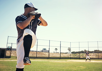 Image showing Throw, sports and baseball with man on field for competition, training and games. Action, exercise and championship with male athlete throwing in stadium park for fitness, pitch and club