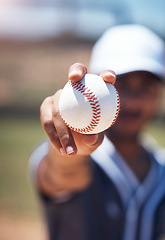 Image showing Hand holding baseball, closeup and man for sport, field and training with blurred background in sunshine. Softball player, sports and zoom of ball for training, fitness and workout for competition