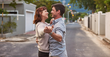 Image showing Dance, street and a happy couple having fun together outdoor while bonding in their domestic neighborhood. Love, road or residential with a man and woman bonding while dancing outside for freedom