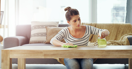 Image showing Woman, clean wooden table with chemical detergent spray and cloth, focus and wipe dirt. Housekeeping, female cleaner concentrate at home with hygiene, cleaning with bottle and disinfecting surface