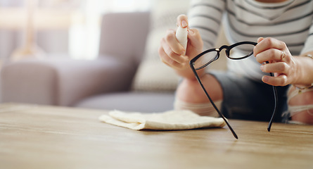 Image showing Hands, woman cleaning glasses and spray bottle with chemical liquid, cloth and hygiene with lens maintenance. Clean spectacles, eyewear and female cleaner at home with eye care and mockup space