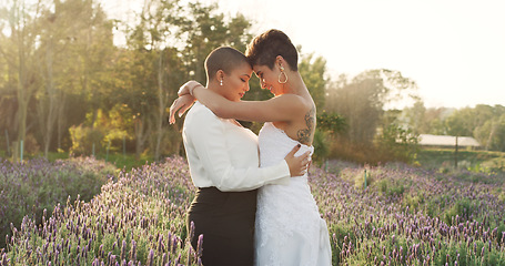 Image showing Love, wedding and lgbtq with lesbian couple in nature for celebration, hugging and pride. Gay, spring and marriage ceremony with women in field for commitment, queer sexuality and freedom