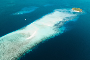 Image showing Top view, blue ocean and island with shallow water for travel, journey or adventure at sea on mockup. Big beach view of calm, peaceful or serene tropical waters above and natural scenic environment