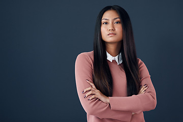 Image showing Confident, portrait of Korean woman and in a studio background with her arms crossed. Empowerment or elegant, corporate worker and pose with serious or proud young businesswoman in a backdrop.