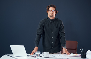 Image showing Portrait, serious and business man, architect or professional in office by wall mockup space. Glasses, designer and confident face of male person from Australia with success mindset and pride for job