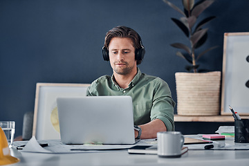 Image showing Music headphones, man and architect on laptop in office streaming radio podcast. Computer, audio or male designer listening to sound or song and working on design, research or engineering floor plan