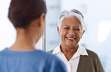 Image showing Healthcare, happy or nurse talking to an old woman about treatment in a nursing home facility clinic. Elderly face, smile or female medical worker speaking to a senior patient in a hospital visit