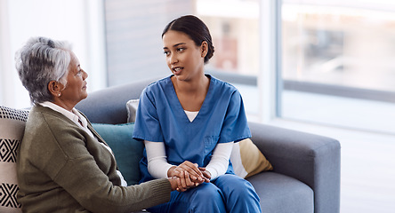 Image showing Old woman, holding hands or consulting a nurse for support or empathy for healthcare help for cancer therapy. Talking, psychology or elderly sick patient in counseling with caregiver in consultation