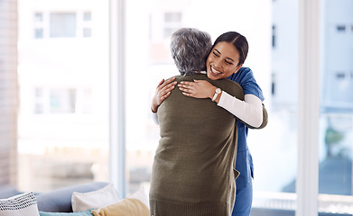 Image showing Hug, nurse and senior woman with a smile, service and healthcare with cure, happiness and help. Female person, medical professional or employee with a patient, embrace and care with support and happy