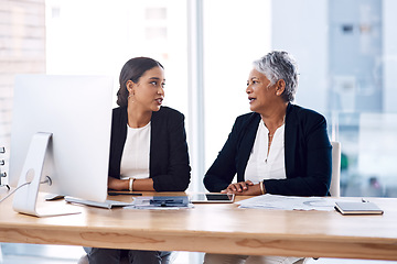 Image showing Mentor, collaboration or business women with computer talking, speaking or planning a project in office. Technology, teamwork or senior manager with female intern for strategy training or coaching