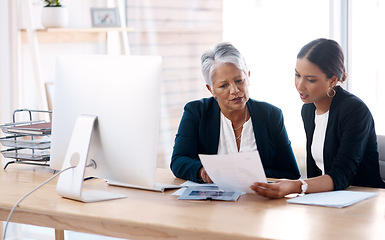 Image showing Mentor, coaching or business women with paperwork talking, speaking or planning project in office. Documents, teamwork collaboration or senior manager reading with intern for administration training