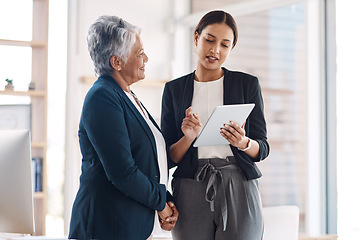 Image showing Mentor, teamwork and business women with tablet for talking, cooperation and planning. Technology, collaboration and happy senior manager with female intern for strategy, office training or coaching.