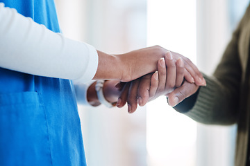 Image showing Woman, holding hands or consulting a nurse for support or empathy for healthcare service of cancer therapy. Closeup, psychology clinic or sick patient in counseling with a caregiver in consultation