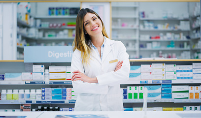 Image showing Pharmacy portrait, arms crossed and happy woman, pharmacist or manager in drugs store, dispensary or shop. Hospital dispensary, medicine product shelf and person confident in retail clinic service