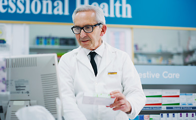 Image showing Pharmacy product, cash register and senior man process sale of pharmaceutical, supplements or pills box. Retail pharmacist, drug store medicine and medical person enter prescription package data