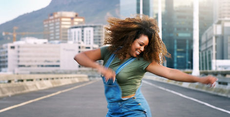 Image showing Dance, happy and a woman in the city street for hip hop, freedom and talent. Smile, excited energy and a young dancing girl in an urban road with creativity, action and happiness with movement