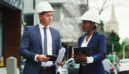 Image showing Architecture, planning and talking people in the city for construction, design and ideas on a tablet. Building, documents and a black woman and man in development speaking about infrastructure ideas