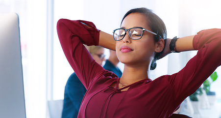 Image showing Relax, computer and a business woman done with her tasks for the day in an office with hands behind her head. Resting, flare and complete with a young female employee working online using a desktop