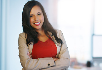 Image showing Portrait, career and woman with arms crossed, professional and confident lady in a workplace. Face, female person and professional with happiness, growth and development with startup success and job