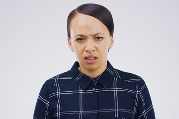 Image showing Confused, doubt and portrait of a woman in studio with an unsure, uncertain or wtf facial expression. Emoji, question and young female person with serious face or emotion isolated by gray background.