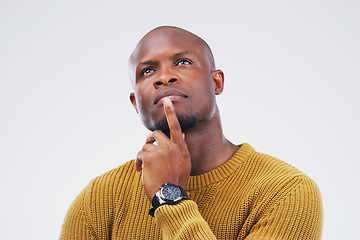 Image showing Thinking, idea and a black man with focus for a decision isolated on a white background in a studio. Planning, young and an African person with ideas, remember plan and a choice on a backdrop