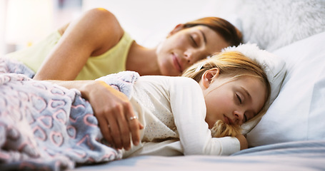 Image showing Relax, sleep and a mother in bed with her daughter in the morning while dreaming in their home together. Family, kids and a woman sleeping in the bedroom with her young female child for peaceful rest