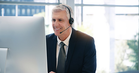 Image showing Video call, computer and a senior business man using a headset in the office during a virtual meeting. Desktop, smile communication with a happy male manager or CEO in an online training workshop