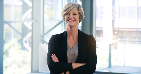 Image showing Business woman, portrait and smile in an office with arms crossed for pride of executive career. Face of a senior female entrepreneur happy about corporate growth, goals and motivation at company