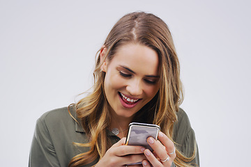 Image showing Phone, laugh and face of woman in studio with smile for social media, internet and online meme. Communication, white background and female person on smartphone for funny website, mobile app and humor