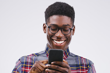 Image showing Phone, happy and face of black man in studio with smile for social media, internet and online chat. Communication, white background and male person on smartphone for website, mobile app and texting